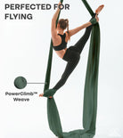 woman performing aerial art using aerial silks Sage green
