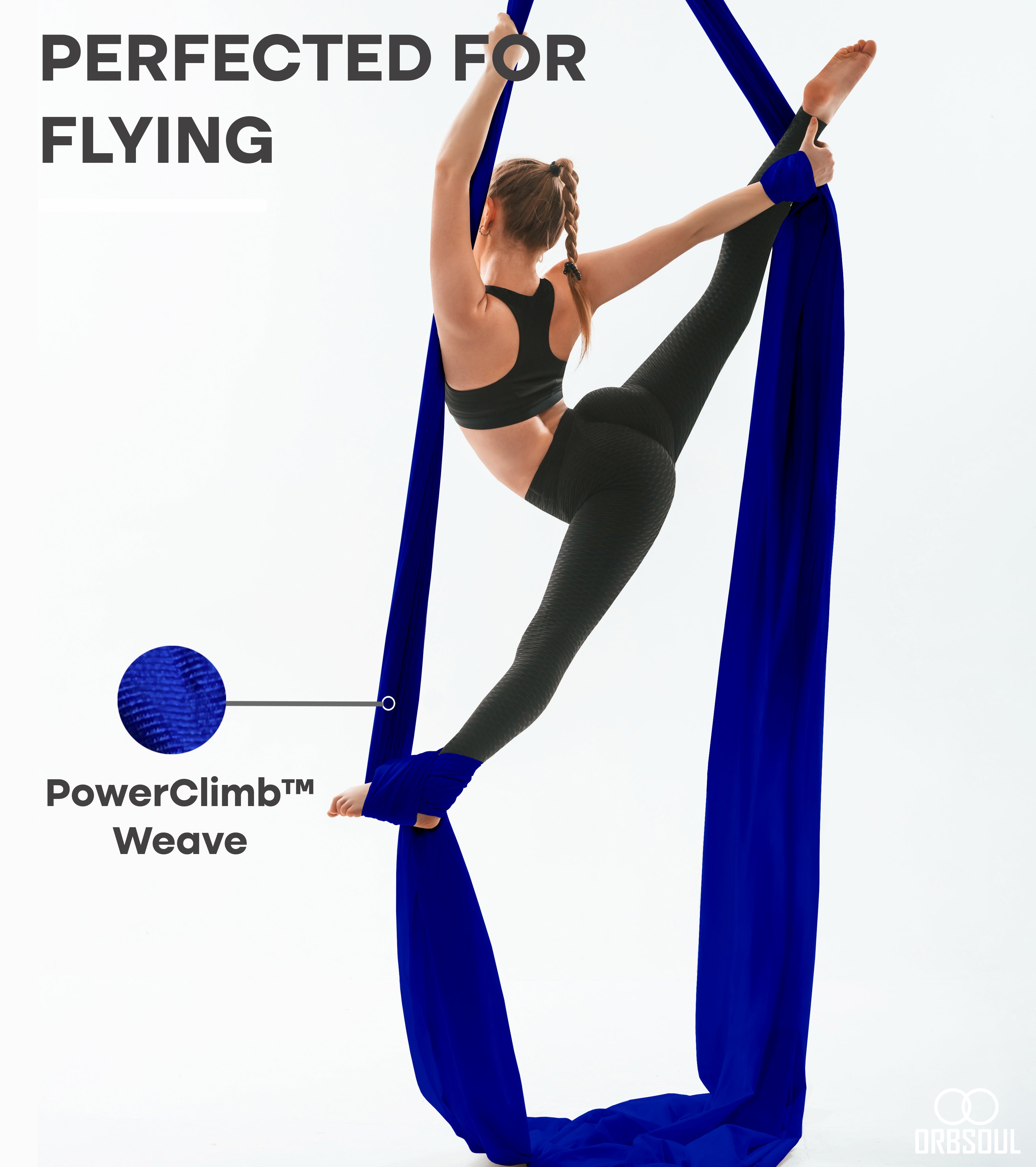 woman performing aerial art using aerial silks sapphire blue