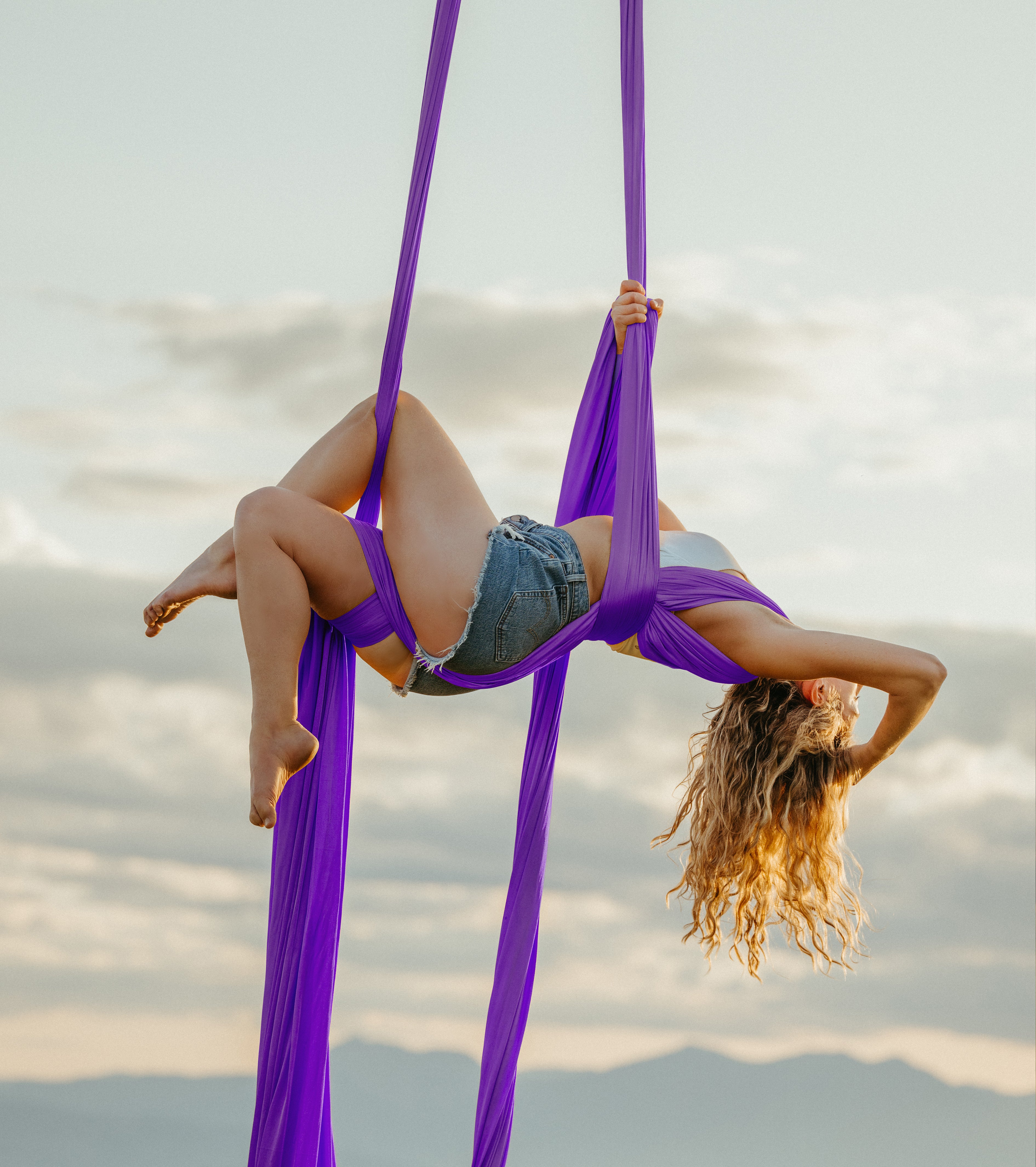 woman performing aerial arts with aerial on farm lush lavender